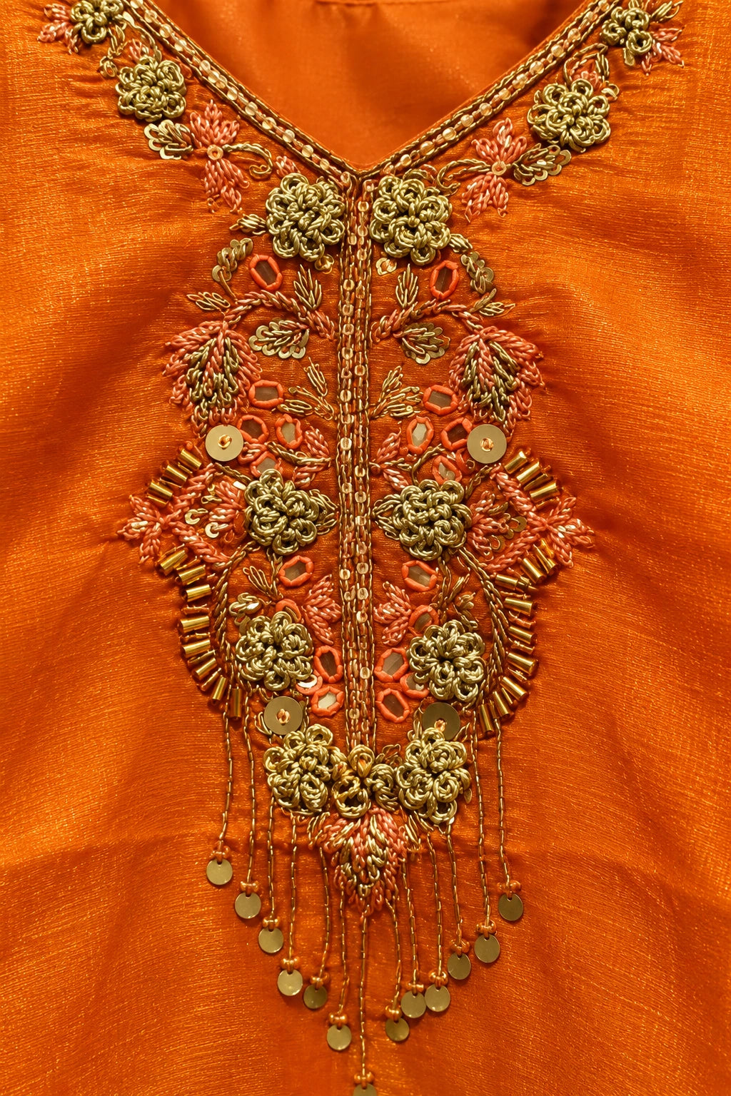 Orange embellished co-ord, work detail macro